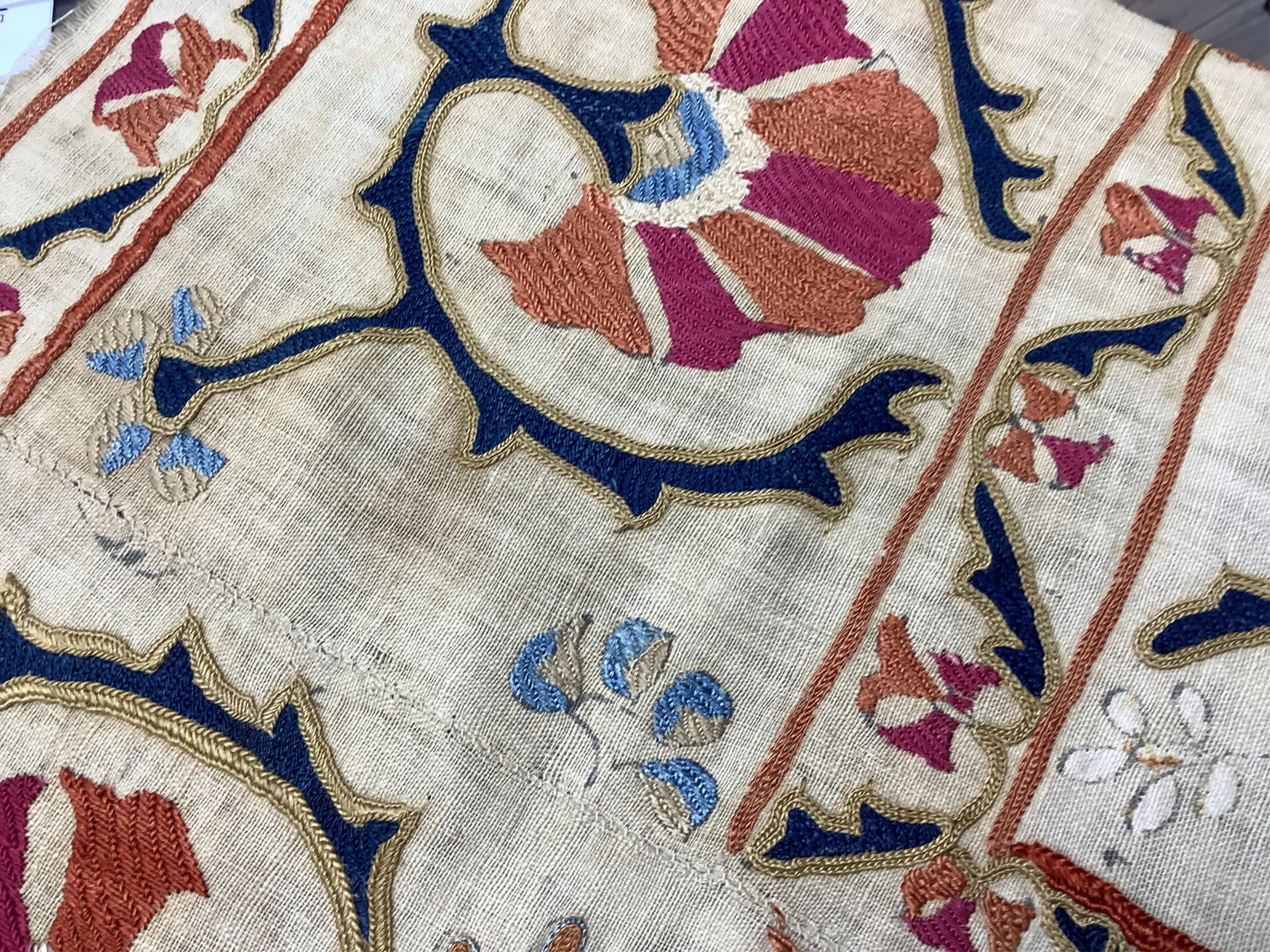 A 19th century Uzbekistan Suzani, hand embroidered hanging. Made from hand woven linen panels each approximately 28cm wide x 167cm long. Hand embroidered with silk hand dyed threads, in orange, red, blue and yellows, usi